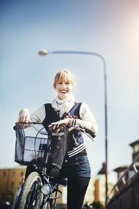Young woman riding bicycle