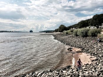 Scenic view of sea against cloudy sky