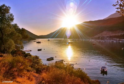 Scenic view of lake against sky during sunset