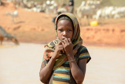 Portrait of boy drinking water