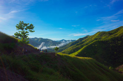 Scenic view of landscape against cloudy sky