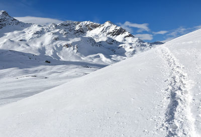 Snow covered mountain against sky