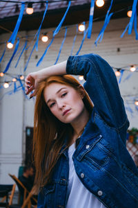 Portrait of beautiful young woman standing outdoors