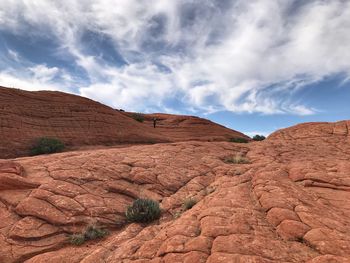 Low angle landscape of multi layered and orange sandstone formations