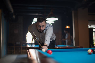Man playing with ball on table