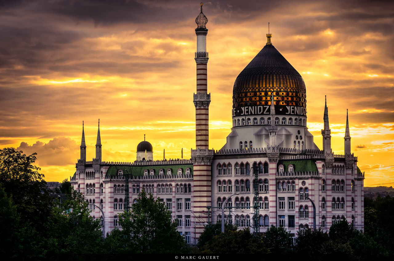 architecture, building exterior, built structure, sunset, sky, place of worship, religion, cloud - sky, orange color, tower, spirituality, church, city, dome, famous place, travel destinations, spire, cloud