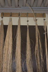 Low angle view of clothes hanging on rope against wall