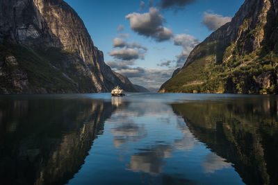 Scenic view of fjord against sky