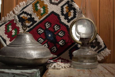Close-up of electric lamp on table