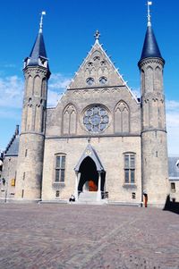 Low angle view of church against blue sky