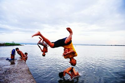 Woman jumping on beach