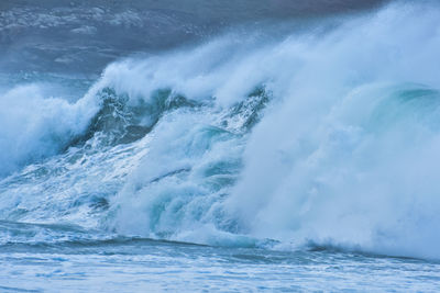 Detail of big waves in rough sea. on a cloudy day. galicia spain.