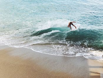 Man jumping on beach