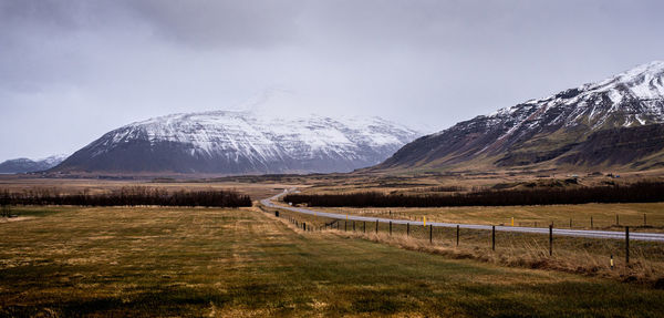 Scenic view of snowcapped mountains against sky