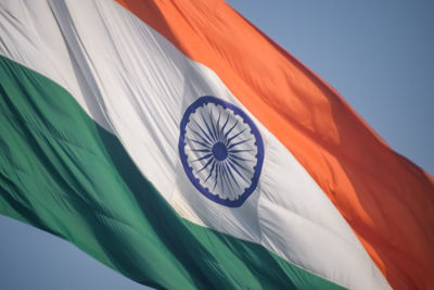 India flag flying high at connaught place with pride in blue sky, india flag fluttering, indian flag