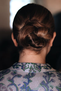 Women's elegant classic bun hairstyle back view