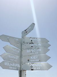 Low angle view of information sign against sky