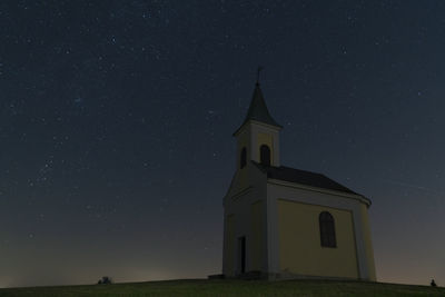 Low angle view of building against sky at night