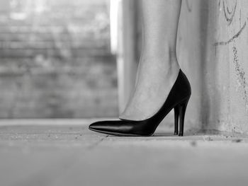 Low section of woman in high heels