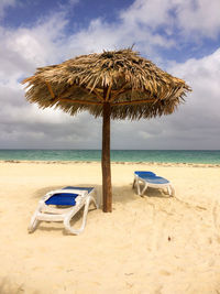 Umbrella and chairs on the golden beach of cuba