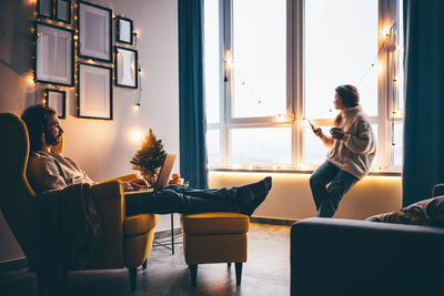 Rear view of woman using mobile phone