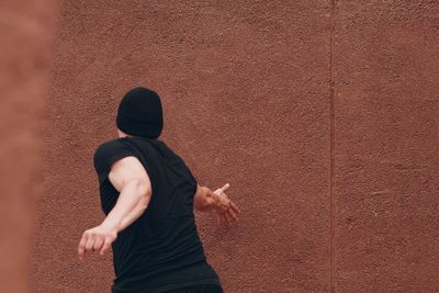 Full length of man against wall