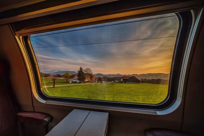 Scenic view of landscape seen through train window