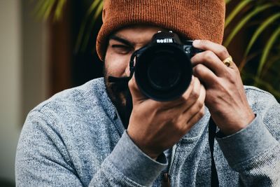 Portrait of man photographing