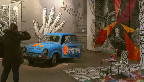 Man on street in city at night