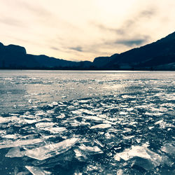 Scenic view of frozen lake against sky