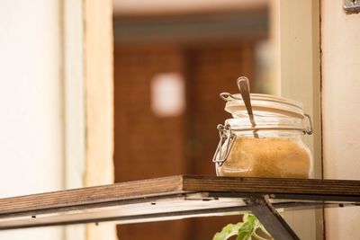 Close-up of glass jar on table