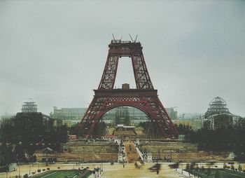 Building seen through eiffel tower