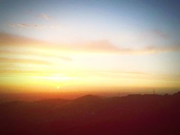 Scenic view of mountains at sunset