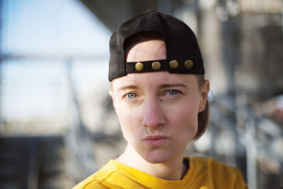 Close-up portrait of woman wearing cap