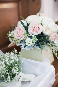 Close-up of white roses on table