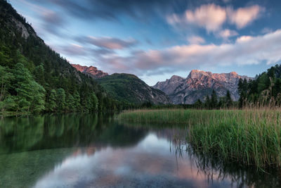 Scenic view of lake and mountains against sky