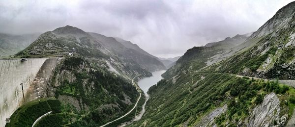 Panoramic view of waterfall against sky