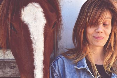 Close-up of woman with horse