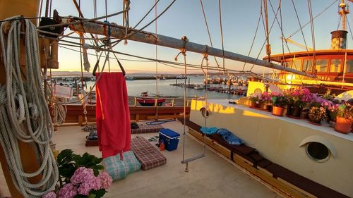 Boats moored in bay against sky