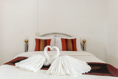 Swan shape sheets on beds at home