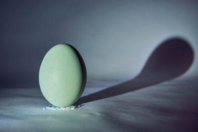 Close-up of green ball on table