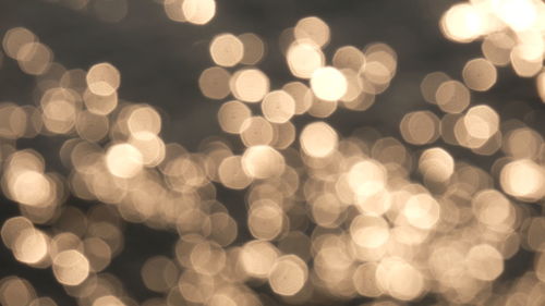 Defocused image of illuminated christmas lights at night