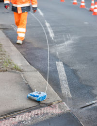 High angle view of man standing on street