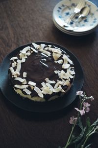 High angle view of chocolate cake in plate on table