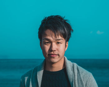 Portrait of man against sea