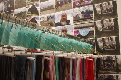 Multi colored flags hanging for sale at market stall