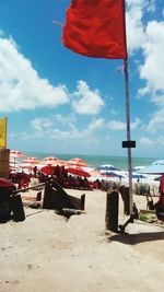 Lifeguard hut on beach against sky in city