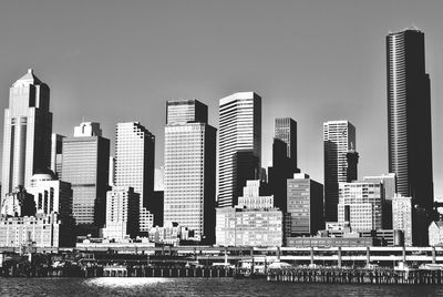 Modern buildings in city against clear sky