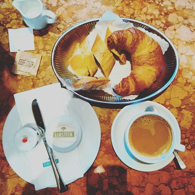 food and drink, coffee cup, drink, table, coffee - drink, indoors, freshness, refreshment, still life, food, coffee, saucer, high angle view, spoon, cup, breakfast, frothy drink, bread, plate, healthy eating