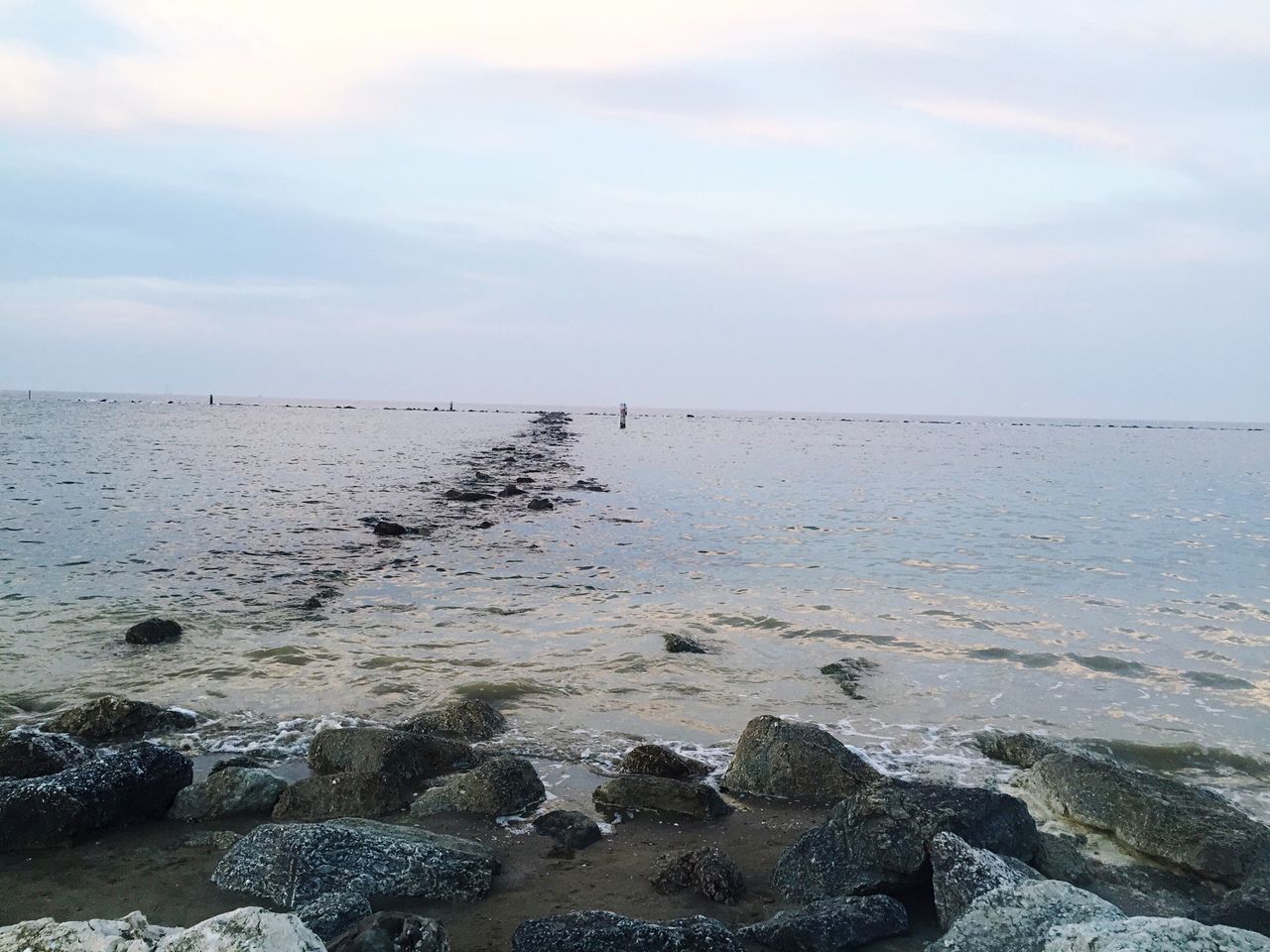 water, sea, tranquil scene, sky, scenics, tranquility, rock - object, beach, beauty in nature, shore, horizon over water, nature, cloud - sky, stone - object, idyllic, rock, coastline, outdoors, remote, cloud